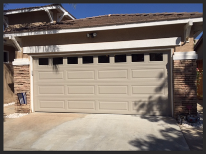 New long panel sectional door in Sandstone with S-100 windows